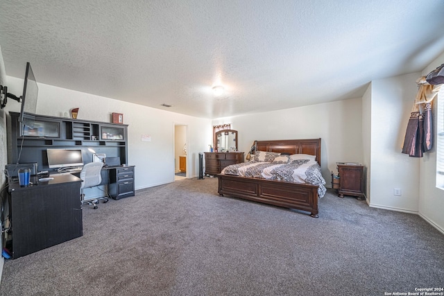 carpeted bedroom featuring a textured ceiling