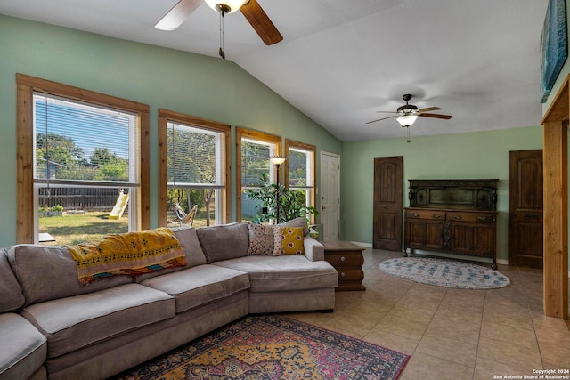 living room featuring ceiling fan, vaulted ceiling, and a healthy amount of sunlight