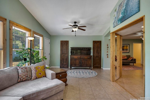 tiled living room with vaulted ceiling and ceiling fan