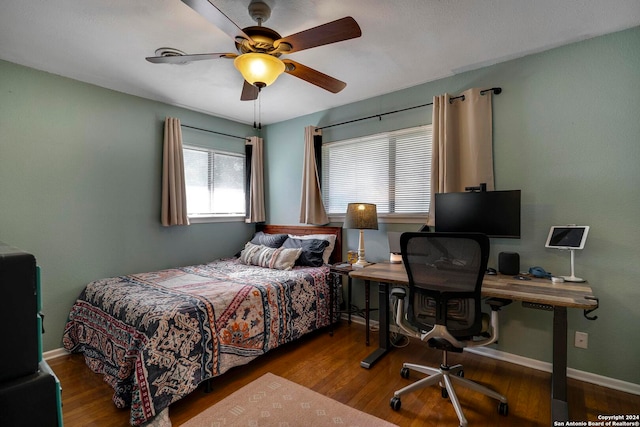 bedroom featuring hardwood / wood-style floors and ceiling fan