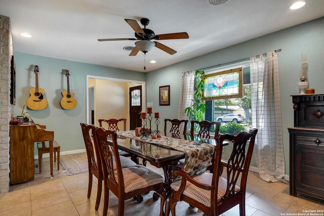 dining room featuring ceiling fan and light tile patterned floors