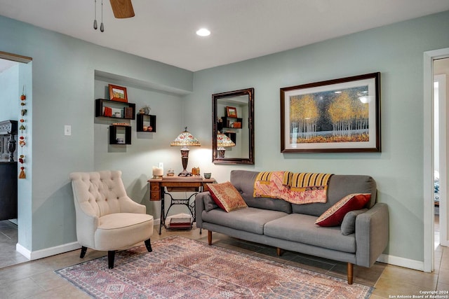 tiled living room with ceiling fan