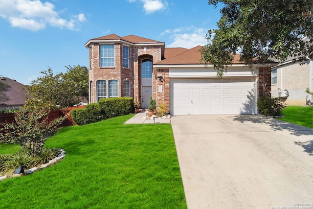 view of front of house featuring a front yard and a garage