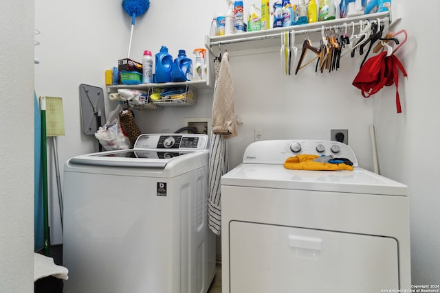 washroom with washing machine and dryer