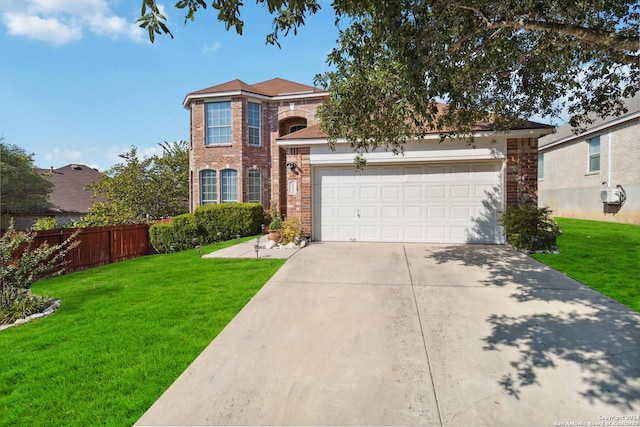 view of front of house with a front yard and a garage