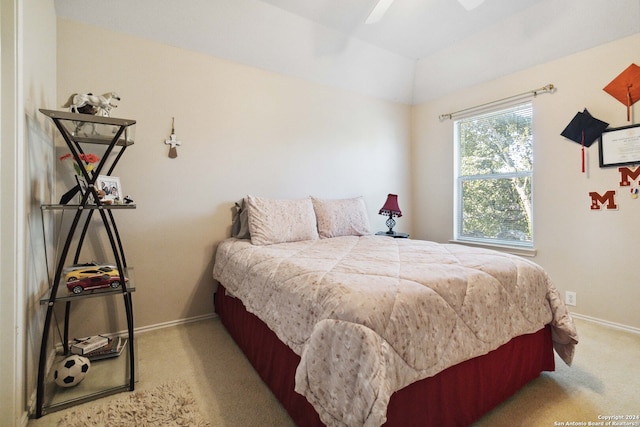 bedroom featuring light colored carpet and ceiling fan