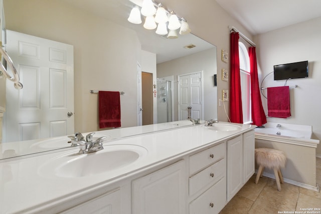 bathroom featuring vanity, shower with separate bathtub, and tile patterned flooring