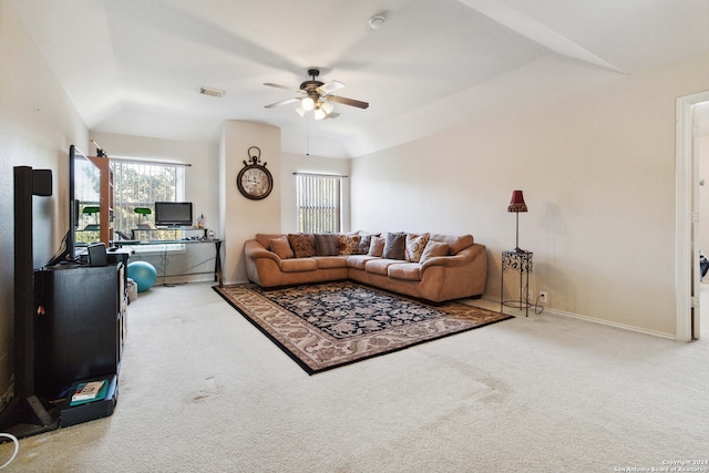 carpeted living room with vaulted ceiling and ceiling fan