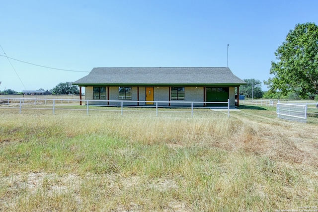 view of front of home featuring a rural view