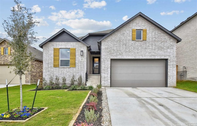 view of front of property with a garage and a front yard