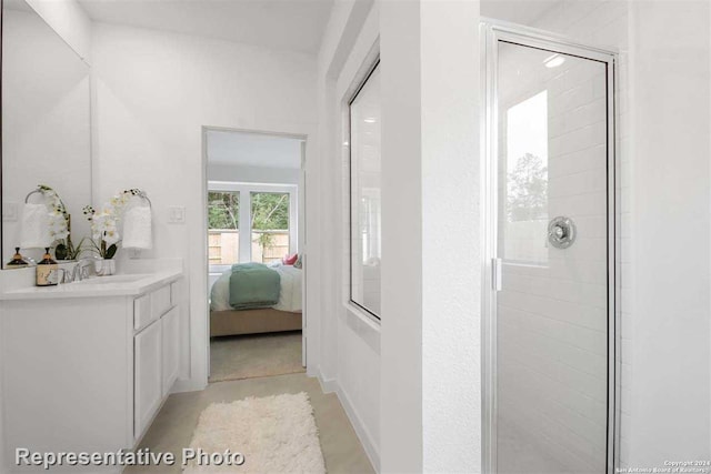 bathroom with an enclosed shower and vanity