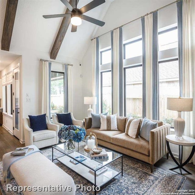 living room featuring ceiling fan, beamed ceiling, dark hardwood / wood-style floors, and a healthy amount of sunlight