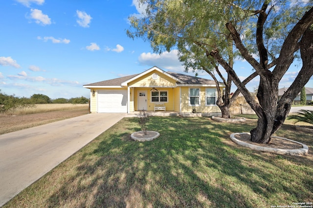 ranch-style house with a front yard and a garage