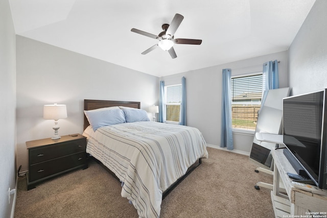 bedroom with multiple windows, ceiling fan, and carpet floors