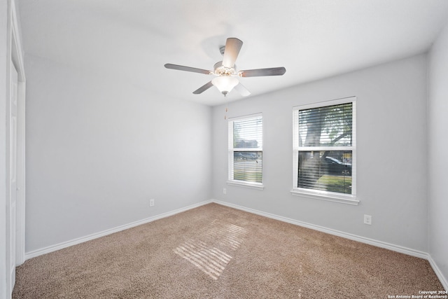 unfurnished room featuring carpet floors and ceiling fan