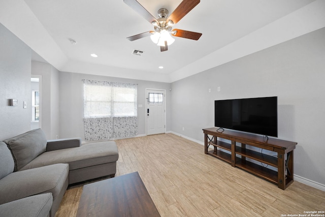 living room featuring ceiling fan and light wood-type flooring