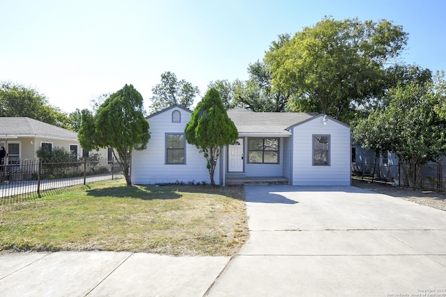 single story home with fence, concrete driveway, and a front yard