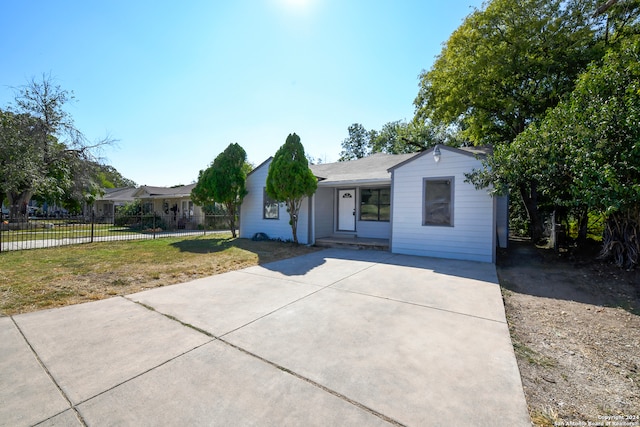 ranch-style house with a front lawn