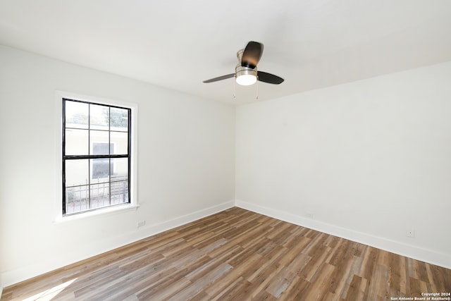 unfurnished room featuring ceiling fan and light hardwood / wood-style flooring