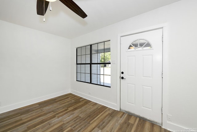 entrance foyer with wood finished floors, a ceiling fan, and baseboards