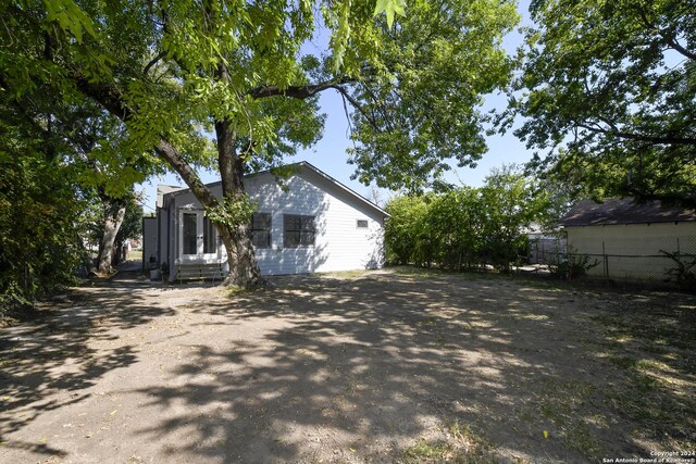 view of side of property with fence