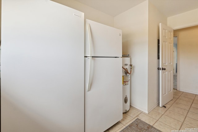 bathroom featuring tile patterned floors and water heater