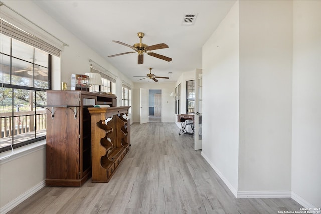 hallway with light hardwood / wood-style flooring