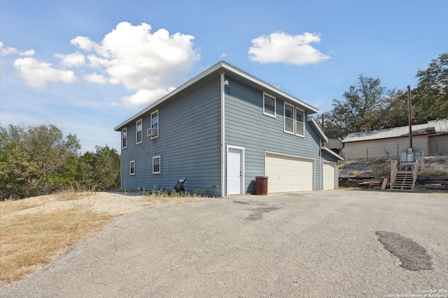 view of property exterior featuring a garage