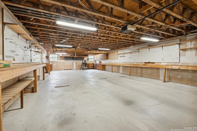 garage featuring a workshop area and a garage door opener