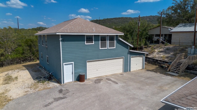 view of property exterior with a garage