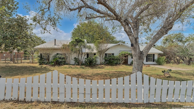 ranch-style house with a front lawn