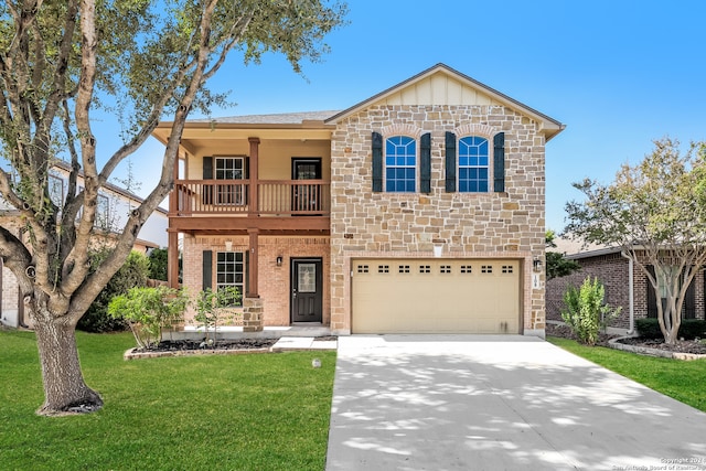 view of front of home featuring a front yard and a garage