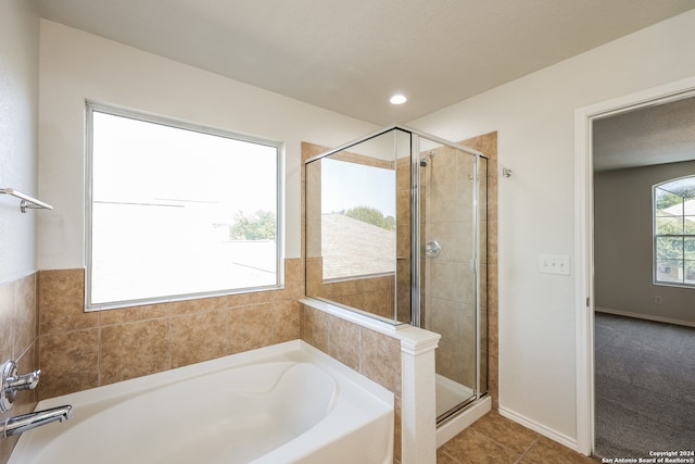 bathroom featuring separate shower and tub and tile patterned floors