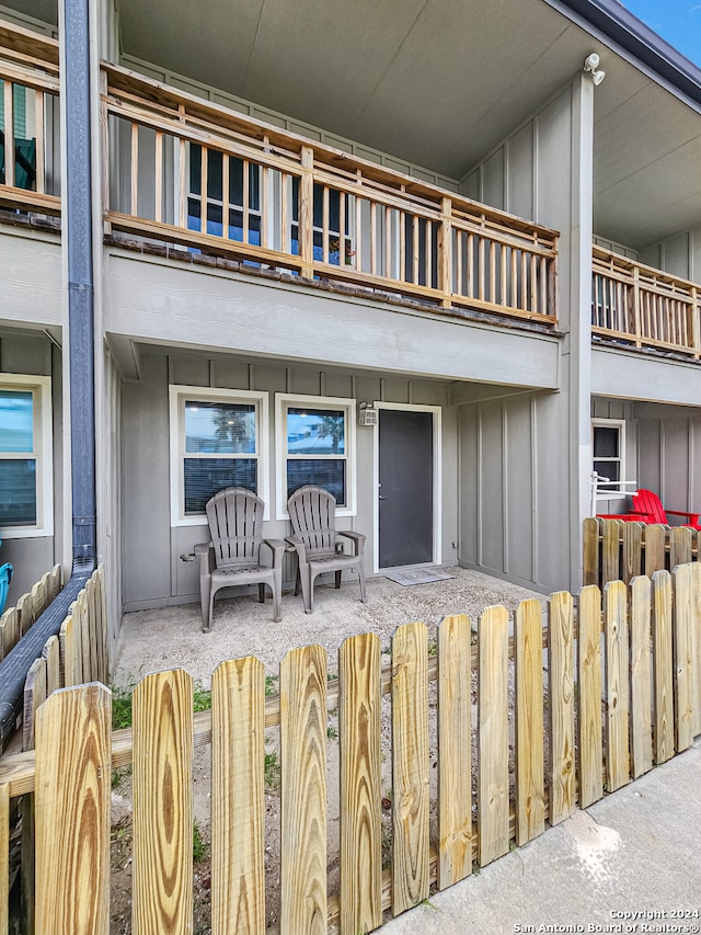 doorway to property with a patio and a balcony