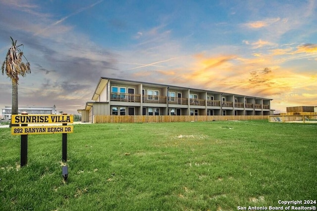 view of outdoor building at dusk