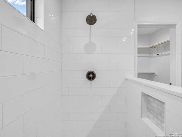 bathroom with tiled shower