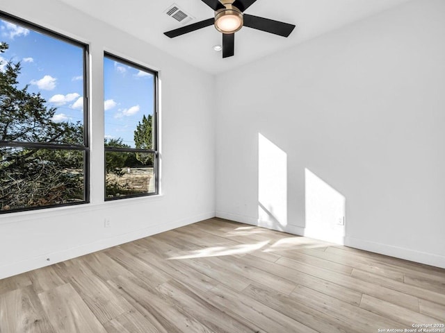 unfurnished room featuring ceiling fan and light hardwood / wood-style floors