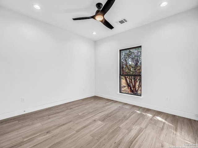 unfurnished room with ceiling fan and light hardwood / wood-style floors