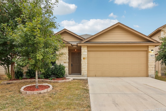 view of front of home with a front lawn and a garage