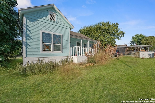 view of home's exterior with a yard