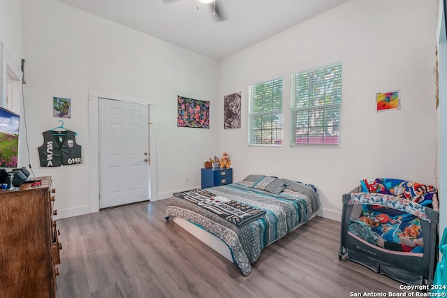 bedroom featuring ceiling fan and light hardwood / wood-style floors