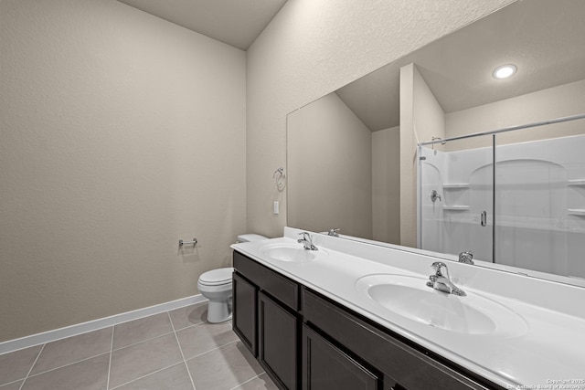 bathroom with walk in shower, tile patterned floors, toilet, and vanity