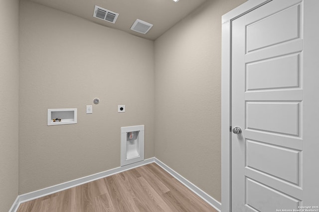 laundry room with hookup for a gas dryer, hookup for a washing machine, hookup for an electric dryer, and light wood-type flooring