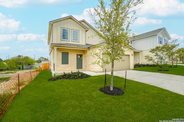 craftsman-style home with a garage and a front lawn