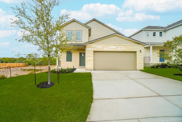 view of front of property featuring a front lawn and a garage