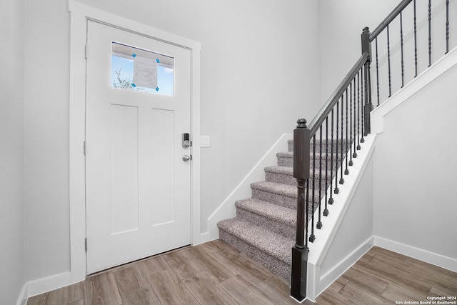 foyer entrance with light hardwood / wood-style flooring