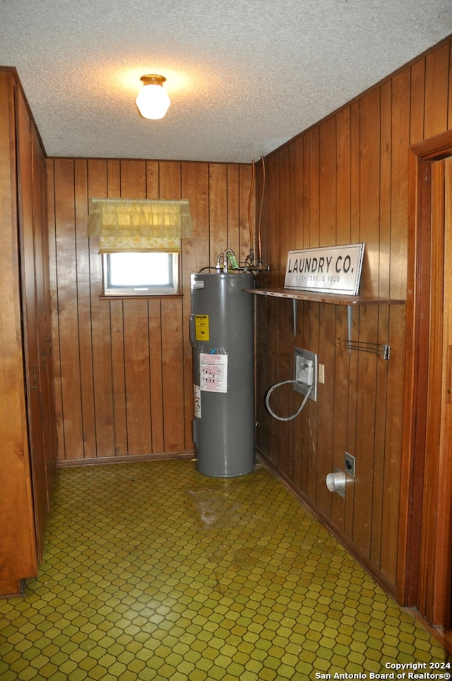 utility room featuring water heater