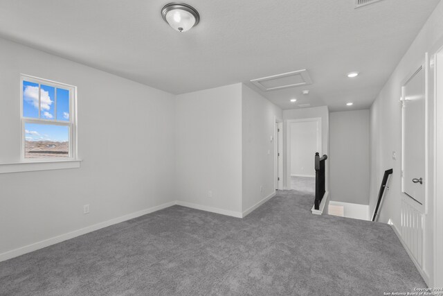 unfurnished room featuring carpet flooring