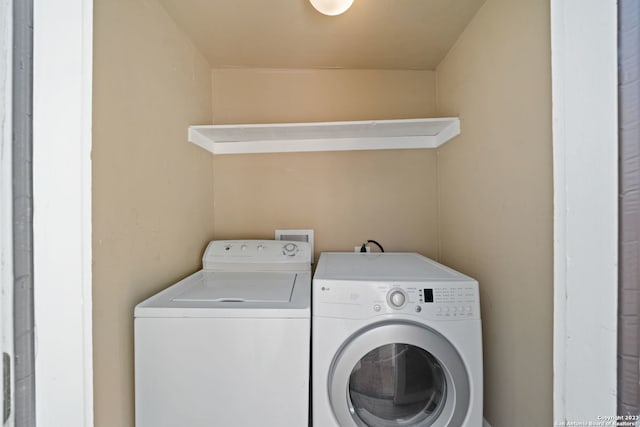 washroom with washer and dryer