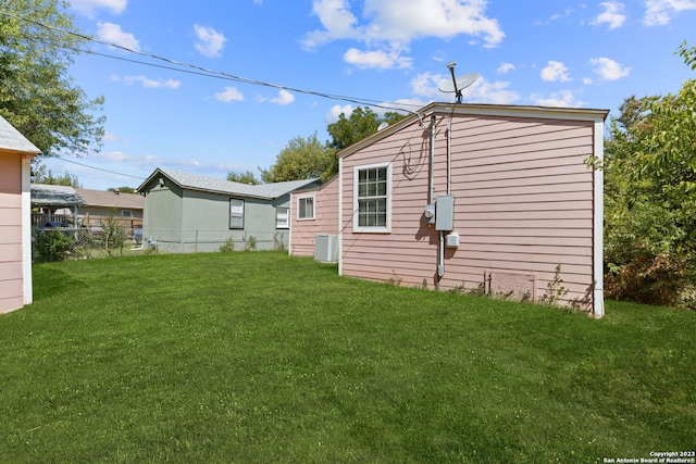 view of property exterior with a lawn